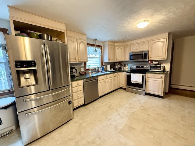 5 Hampton Rd, Enfield, CT 06082 - kitchen featuring appliances with stainless steel finishes, dark countertops, a baseboard heating unit, and light brown cabinets