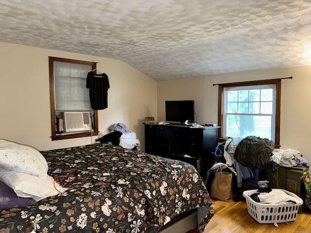 5 Hampton Rd, Enfield, CT 06082 - bedroom with a textured ceiling, cooling unit, wood finished floors, and vaulted ceiling