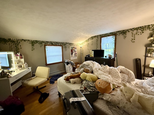 5 Hampton Rd, Enfield, CT 06082 - bedroom with wood finished floors, multiple windows, a baseboard heating unit, and vaulted ceiling