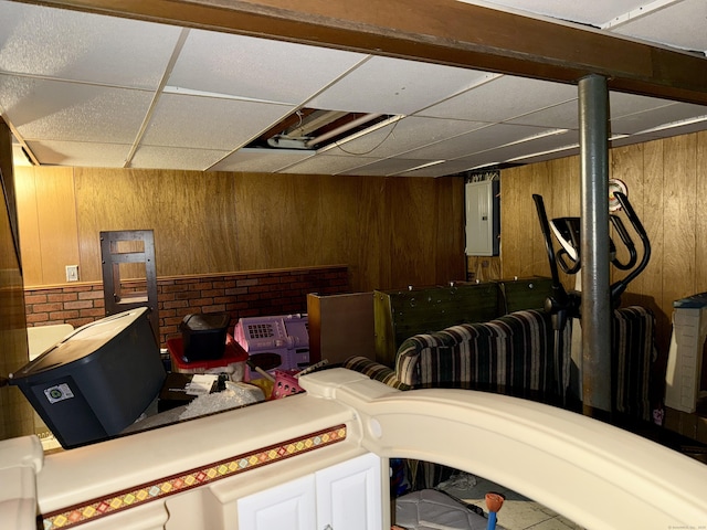 5 Hampton Rd, Enfield, CT 06082 - finished basement with a drop ceiling, wooden walls, and electric panel