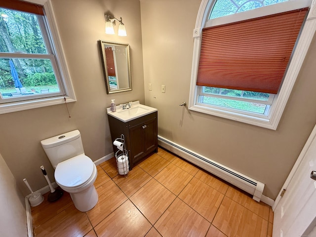 5 Hampton Rd, Enfield, CT 06082 - half bath featuring a baseboard heating unit, vanity, and tile patterned floors