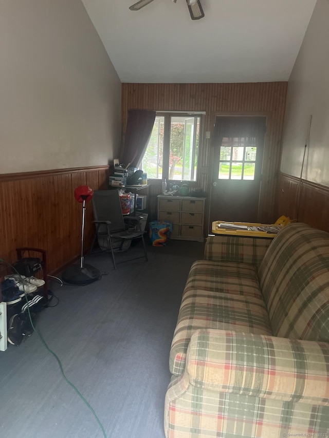 5 Hampton Rd, Enfield, CT 06082 - carpeted living room with wooden walls, plenty of natural light, a wainscoted wall, and a ceiling fan