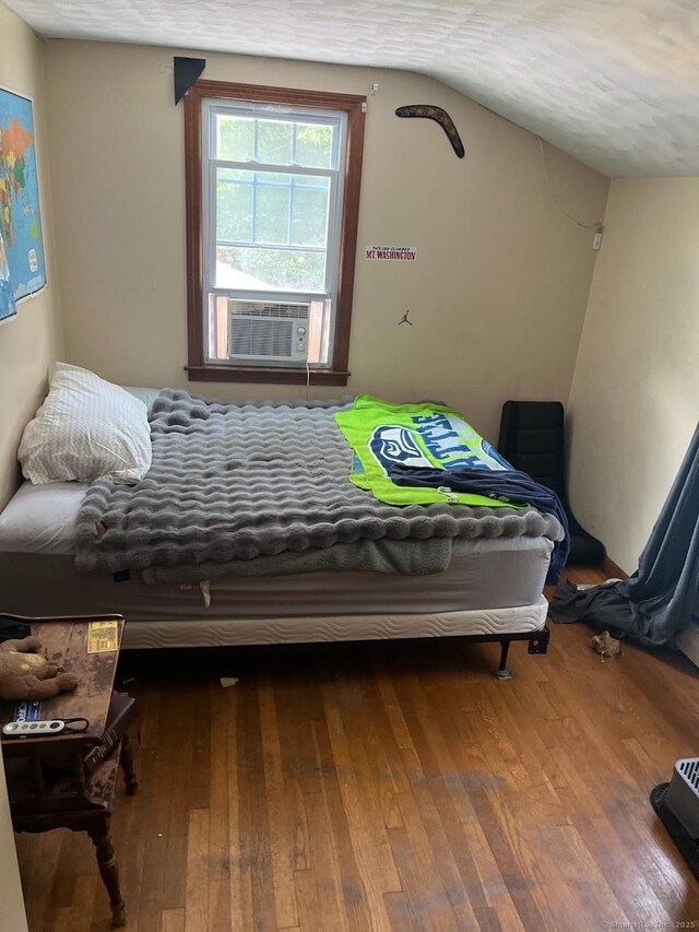 5 Hampton Rd, Enfield, CT 06082 - bedroom with cooling unit, hardwood / wood-style floors, and vaulted ceiling