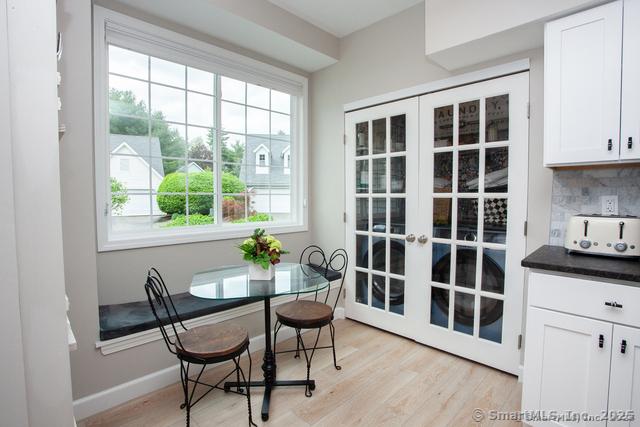 41 Stratton Forest Way, Simsbury, CT 06070 - dining room featuring light wood-style floors, baseboards, and french doors