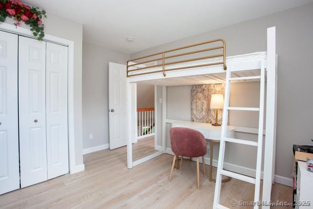 41 Stratton Forest Way, Simsbury, CT 06070 - bedroom with light wood finished floors, baseboards, and a closet