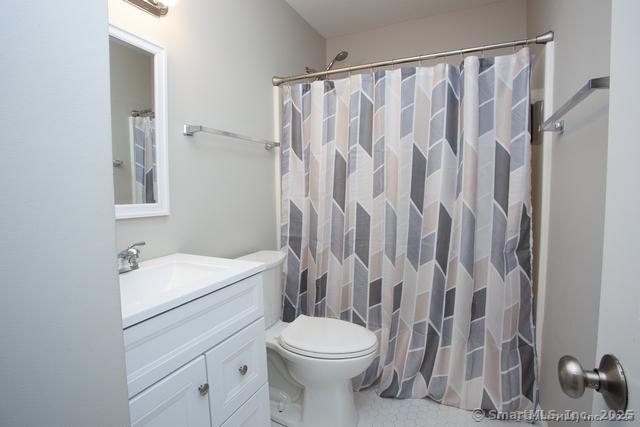41 Stratton Forest Way, Simsbury, CT 06070 - full bathroom with vanity, toilet, and a shower with curtain