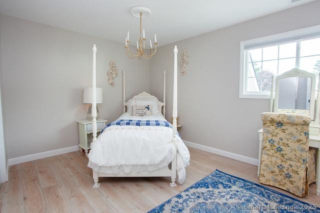 41 Stratton Forest Way, Simsbury, CT 06070 - bedroom featuring a chandelier, light wood-type flooring, and baseboards