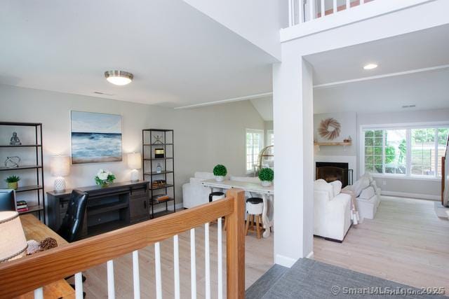 41 Stratton Forest Way, Simsbury, CT 06070 - living room featuring a fireplace, wood finished floors, and baseboards