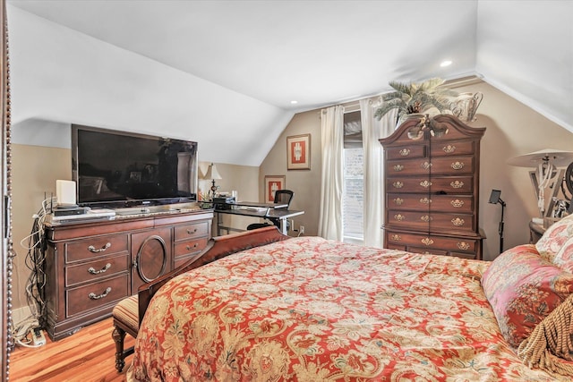 bedroom featuring recessed lighting, lofted ceiling, and light wood-style floors