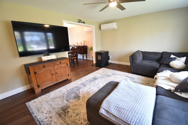 living area with dark wood-style floors, baseboards, a wall unit AC, and ceiling fan