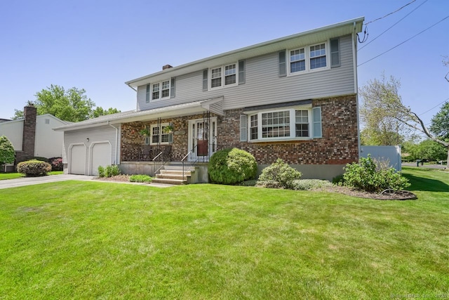 330 Flagler Ave, Stratford, CT 06614 - view of front of home featuring a garage, concrete driveway, brick siding, and a front yard