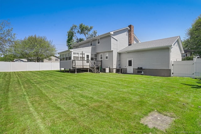 330 Flagler Ave, Stratford, CT 06614 - back of property featuring a chimney, a gate, a sunroom, a deck, and central air condition unit