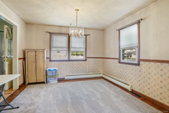 330 Flagler Ave, Stratford, CT 06614 - empty room featuring wallpapered walls, a chandelier, wood finished floors, and baseboard heating
