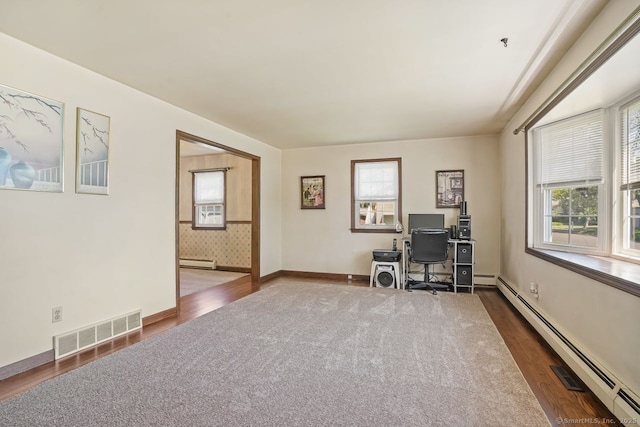 330 Flagler Ave, Stratford, CT 06614 - office space with a baseboard heating unit, a baseboard radiator, dark wood finished floors, and plenty of natural light