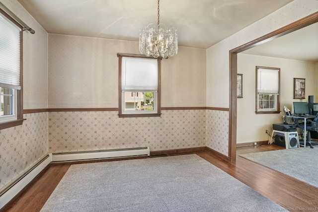330 Flagler Ave, Stratford, CT 06614 - unfurnished room with wallpapered walls, dark wood finished floors, a chandelier, healthy amount of natural light, and a baseboard radiator