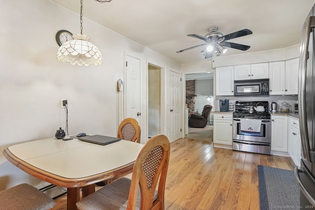 330 Flagler Ave, Stratford, CT 06614 - dining area with ceiling fan, light wood-type flooring, and a baseboard radiator