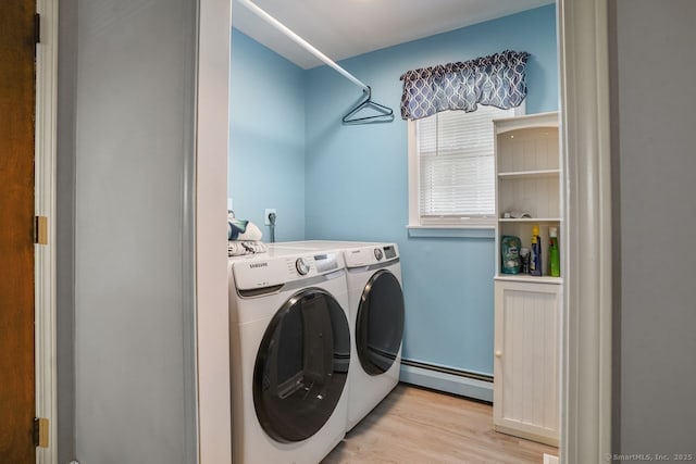 330 Flagler Ave, Stratford, CT 06614 - washroom with baseboard heating, washing machine and dryer, and wood finished floors