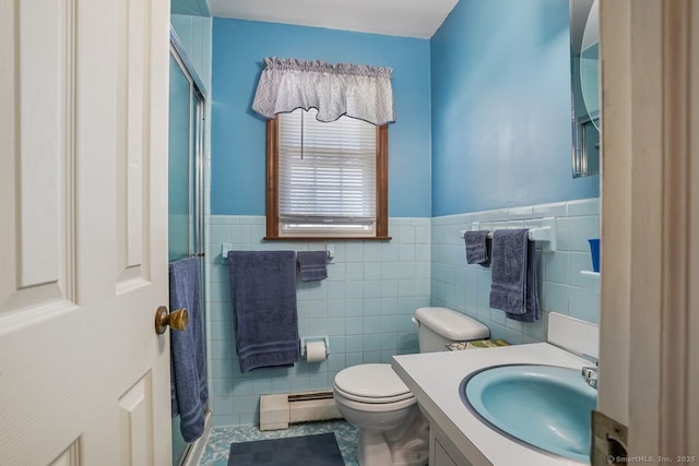 330 Flagler Ave, Stratford, CT 06614 - bathroom featuring baseboard heating, tile walls, vanity, toilet, and wainscoting