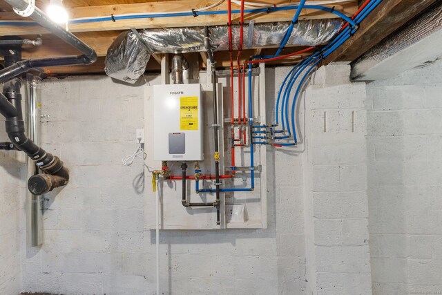 utility room featuring tankless water heater