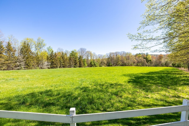 view of yard with a wooded view