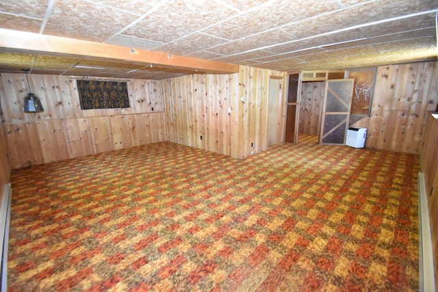 finished below grade area with wood walls and carpet