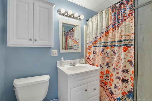 bathroom featuring toilet, a shower with curtain, and vanity
