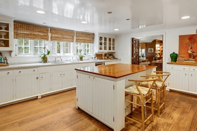 35 Old Redding Rd, Easton, CT 06612 - kitchen featuring light wood finished floors, butcher block countertops, a kitchen island, a breakfast bar, and recessed lighting