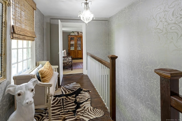 35 Old Redding Rd, Easton, CT 06612 - corridor featuring wood finished floors, an upstairs landing, wallpapered walls, and a chandelier
