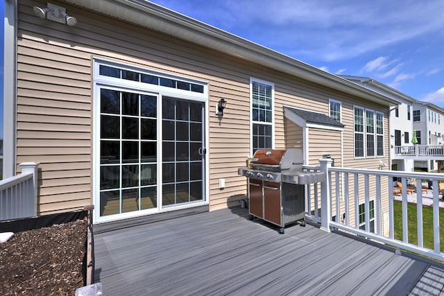 wooden deck featuring grilling area