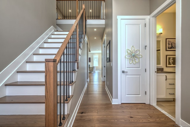 interior space with baseboards and wood finished floors