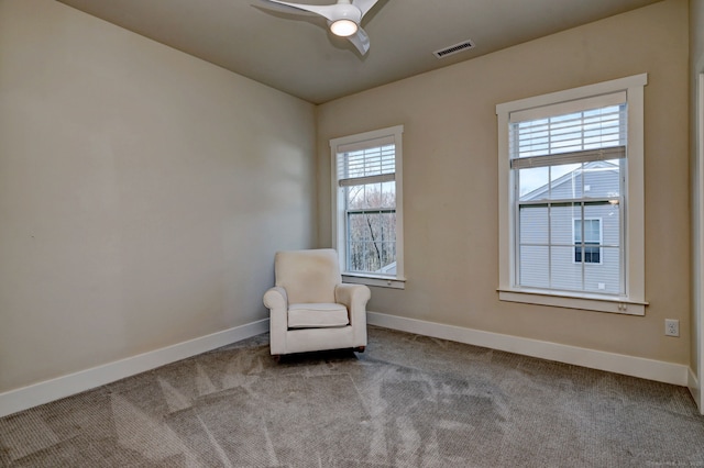 unfurnished room with baseboards, visible vents, and carpet floors