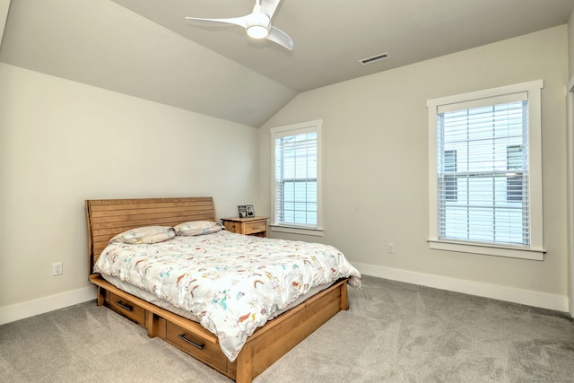 carpeted bedroom featuring baseboards, visible vents, ceiling fan, and lofted ceiling