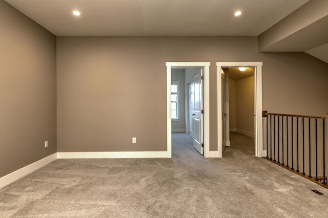interior space with baseboards, recessed lighting, and carpet flooring