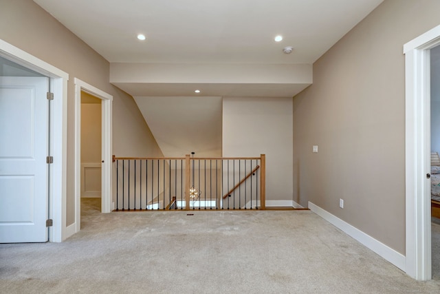 interior space with baseboards and recessed lighting