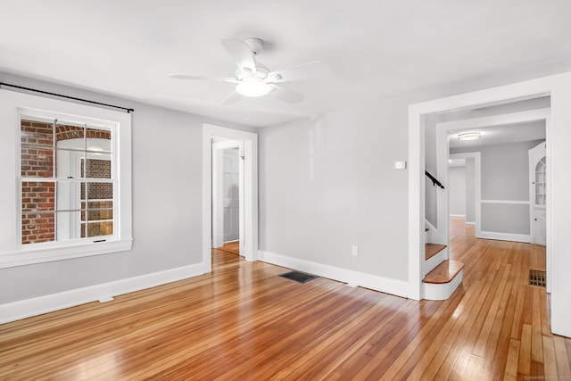 61 Longview Ave, Fairfield, CT 06824 - unfurnished room featuring baseboards, light wood finished floors, visible vents, and stairway
