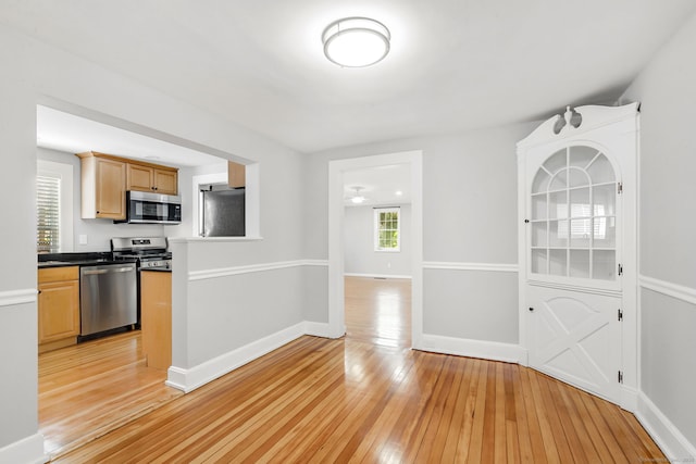 61 Longview Ave, Fairfield, CT 06824 - kitchen with baseboards, light wood finished floors, and stainless steel appliances