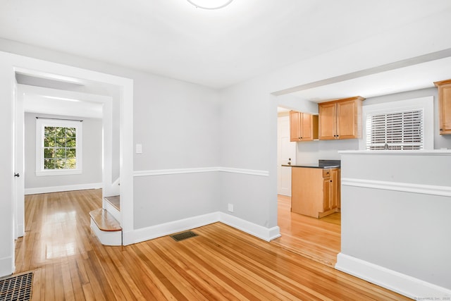 61 Longview Ave, Fairfield, CT 06824 - interior space with visible vents, light wood-style flooring, baseboards, and dark countertops