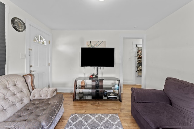 6 Beech St, Bristol, CT 06010 - living area featuring baseboards and light wood finished floors