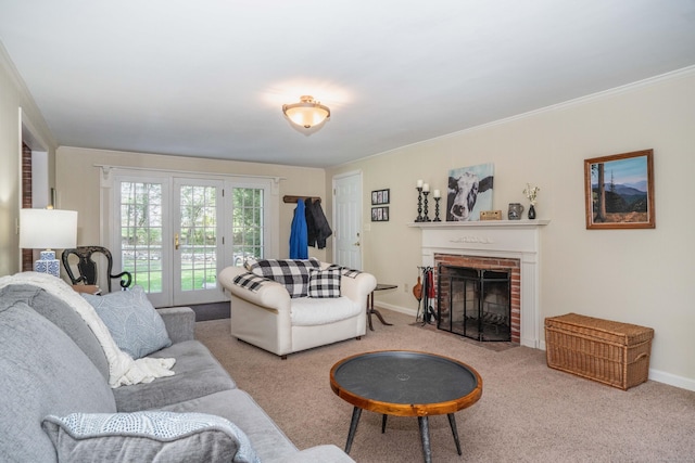 carpeted living room featuring baseboards, ornamental molding, a brick fireplace, and french doors