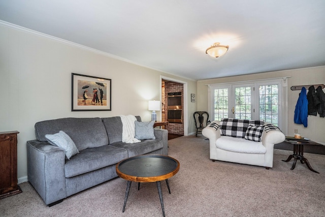 carpeted living area featuring crown molding and baseboards