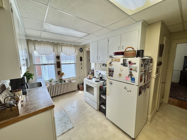 78-80 Lancaster Rd, West Hartford, CT 06119 - kitchen with radiator, white appliances, light floors, white cabinetry, and a sink