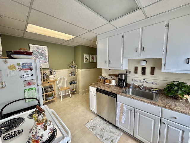 78-80 Lancaster Rd, West Hartford, CT 06119 - kitchen with a sink, white cabinetry, a drop ceiling, and white appliances