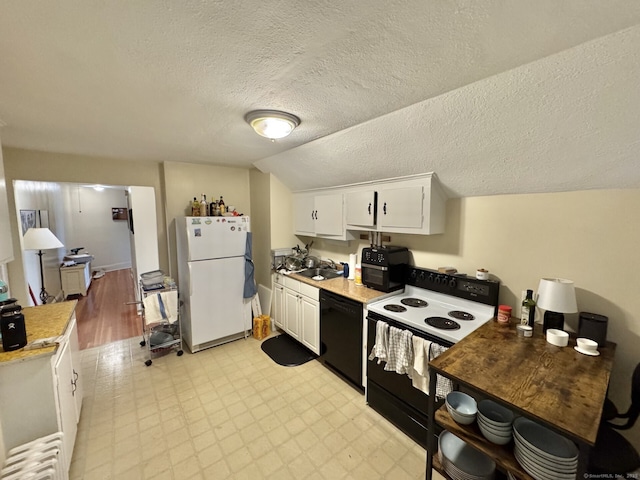 78-80 Lancaster Rd, West Hartford, CT 06119 - kitchen with white cabinets, a sink, dishwasher, range with electric cooktop, and freestanding refrigerator