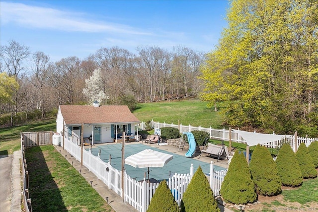 view of swimming pool featuring a water slide, a fenced backyard, a fenced in pool, and a patio area
