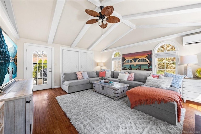 sunroom with beam ceiling, a wall mounted AC, and plenty of natural light
