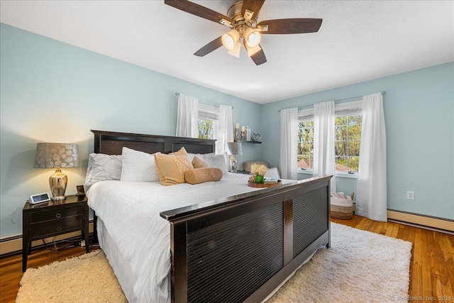 bedroom with wood finished floors and a ceiling fan