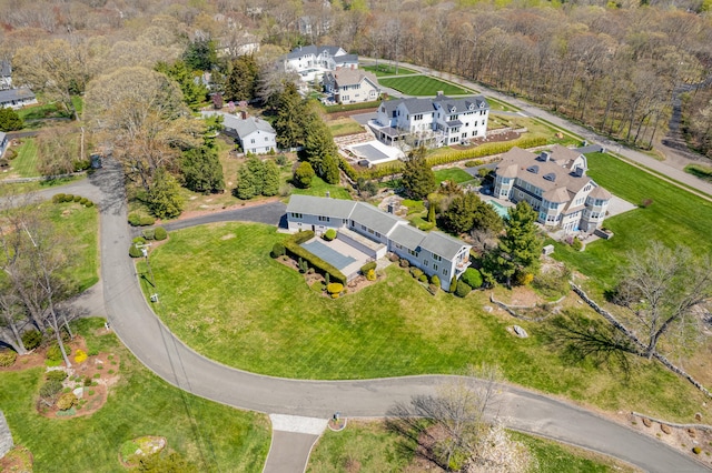 drone / aerial view with a wooded view