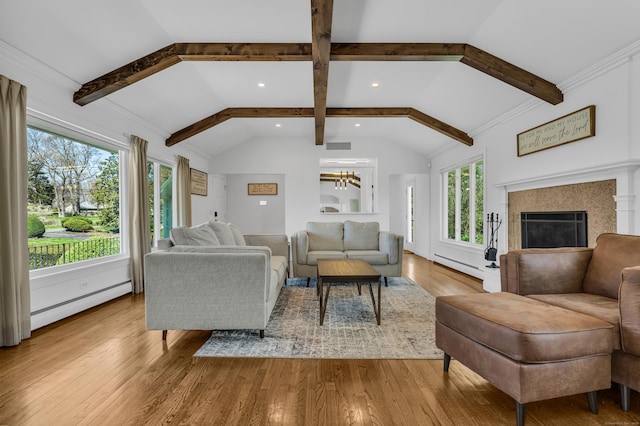 living room featuring a fireplace, lofted ceiling with beams, wood finished floors, and a baseboard radiator