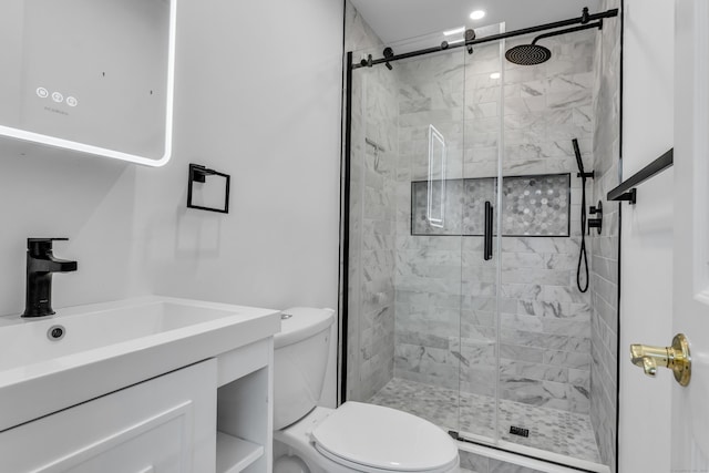 full bath featuring vanity, toilet, and a shower stall