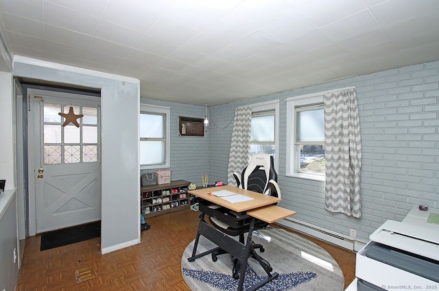 office area featuring a baseboard radiator, a wall mounted air conditioner, and plenty of natural light